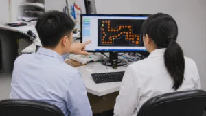 Engineers reviewing PCB assembly files for an accurate quotation
