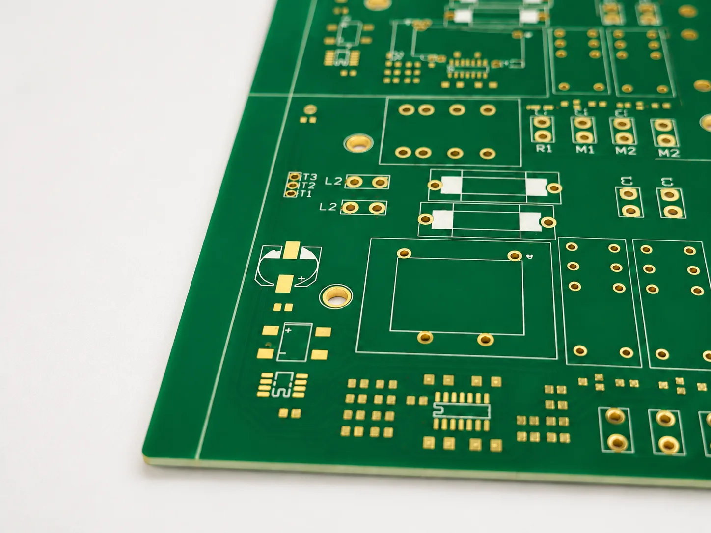 Green PCB with component footprints and plated holes for PCB layout process review Select 87 more words to run Humanizer.