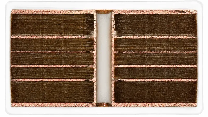 Multilayer PCB cross-section showing copper layers and plated through-hole