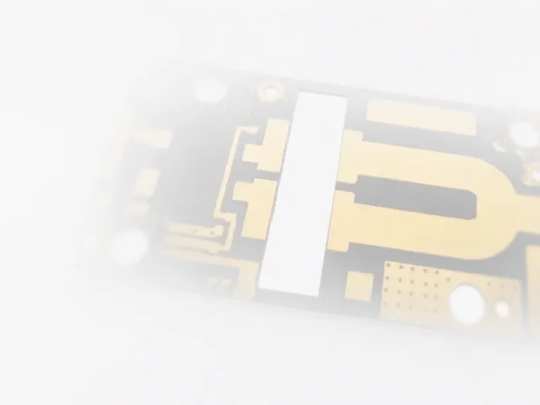 High-frequency RF microwave PCB layout showing gold microstrip traces and via array for signal integrity.